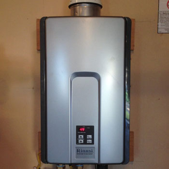 Rinnai tankless water heater mounted on wall